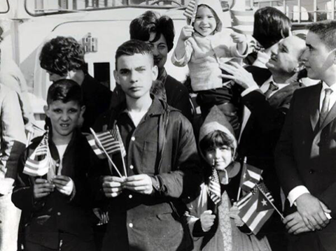 Image of A group of young Cuban refugees entering the U.S. as part of the Cuban airlift arrive in Miami in 1967. *USCIS History Library.